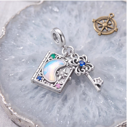 Magic Book Key Dangle styled as a gift