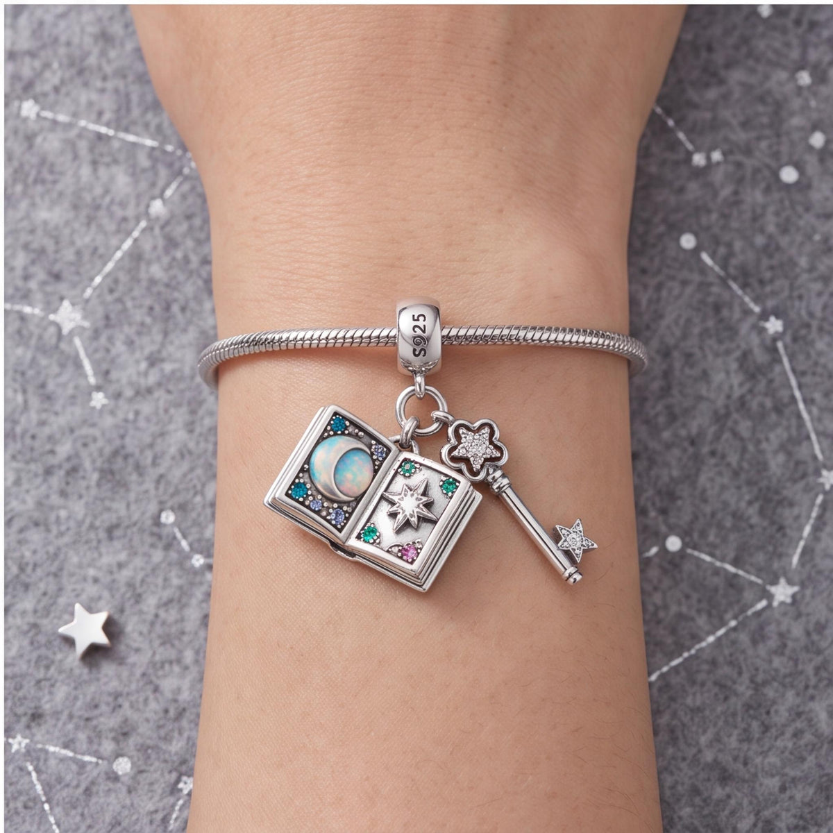 Magic Book Key Dangle close-up on a bracelet