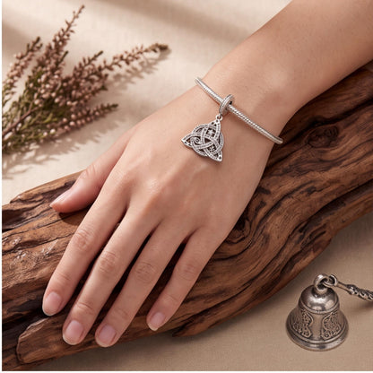 Trinity Knot Charm worn on a charm bracelet