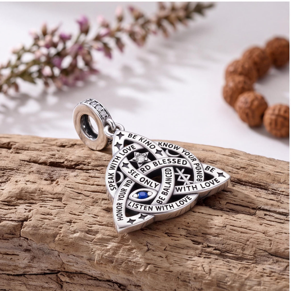 Trinity Knot Charm styled as a gift