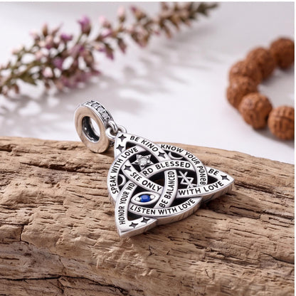 Trinity Knot Charm styled as a gift