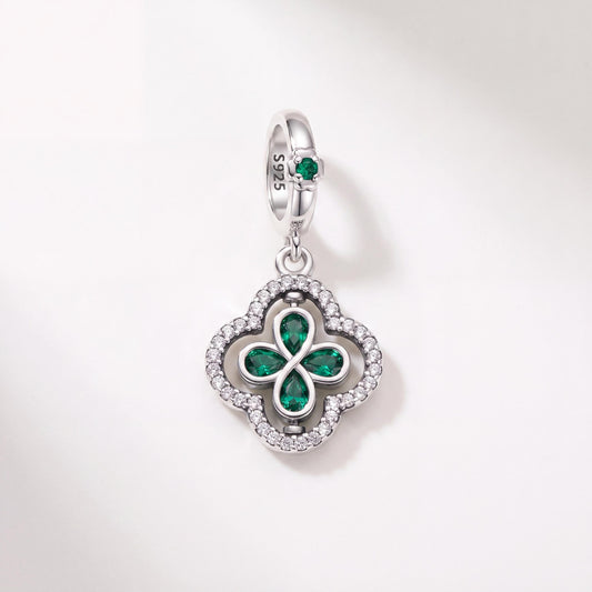 Clover Infinity Dangle in 925 sterling silver with green enamel and sparkling stones, fits European-style charm bracelets