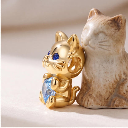 Cat Holding Heart Charm on a silver charm bracelet