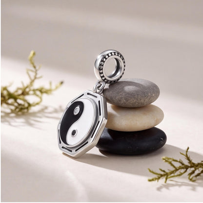 Yin Yang Bagua Charm on a silver charm bracelet
