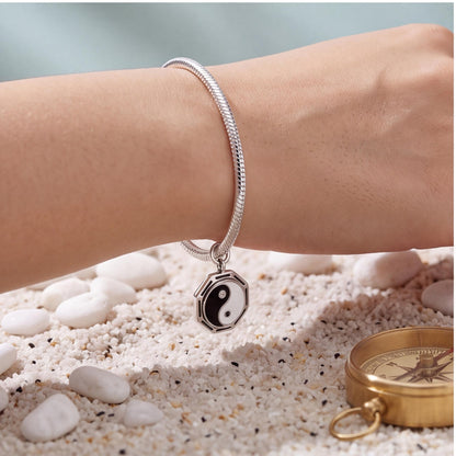 Yin Yang Bagua Charm close-up on a bracelet
