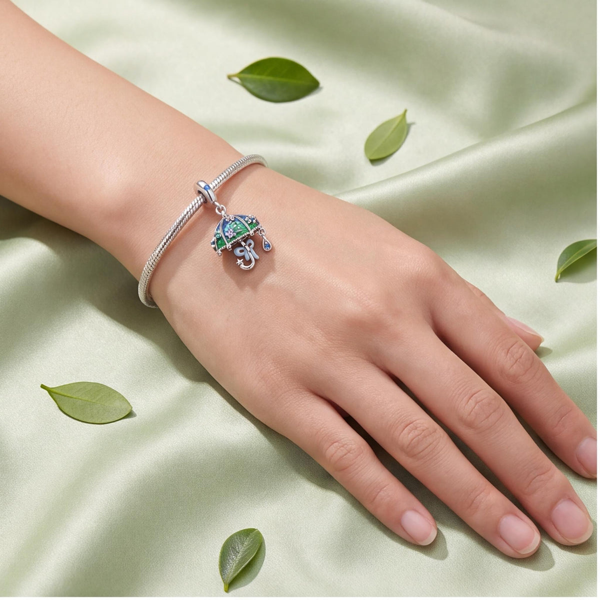 Raindrop Umbrella Charm close-up on a bracelet