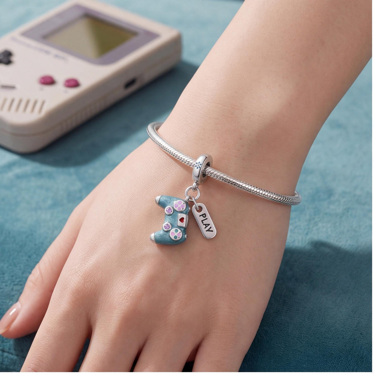 Gaming Controller Dangle Charm worn on a charm bracelet