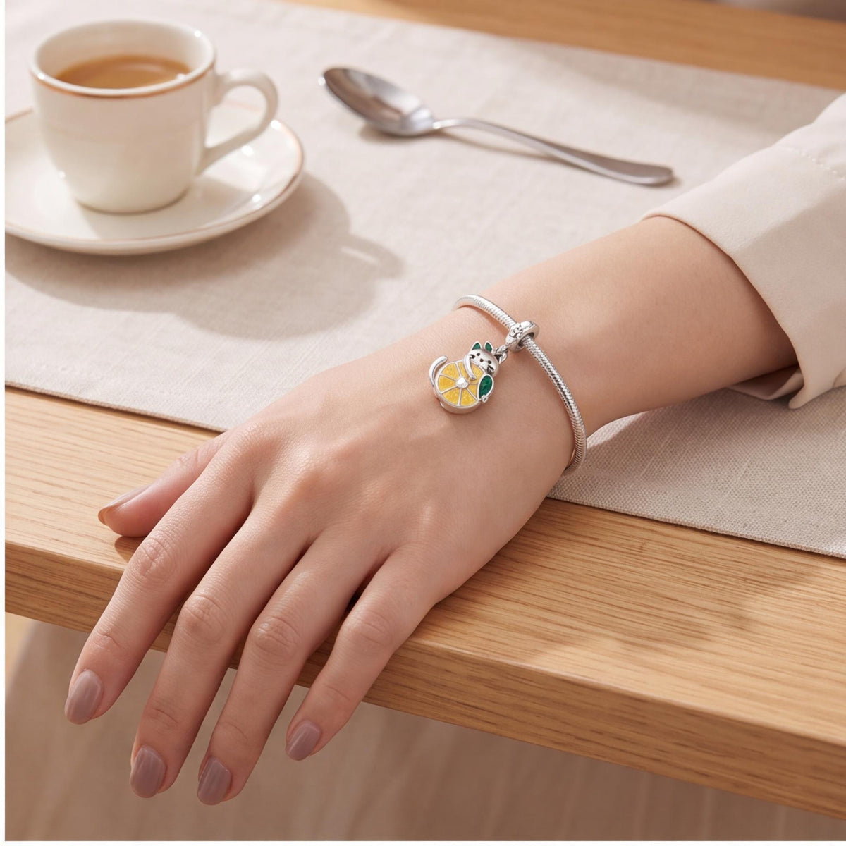 Cat Lemon Dangle Charm worn on a charm bracelet