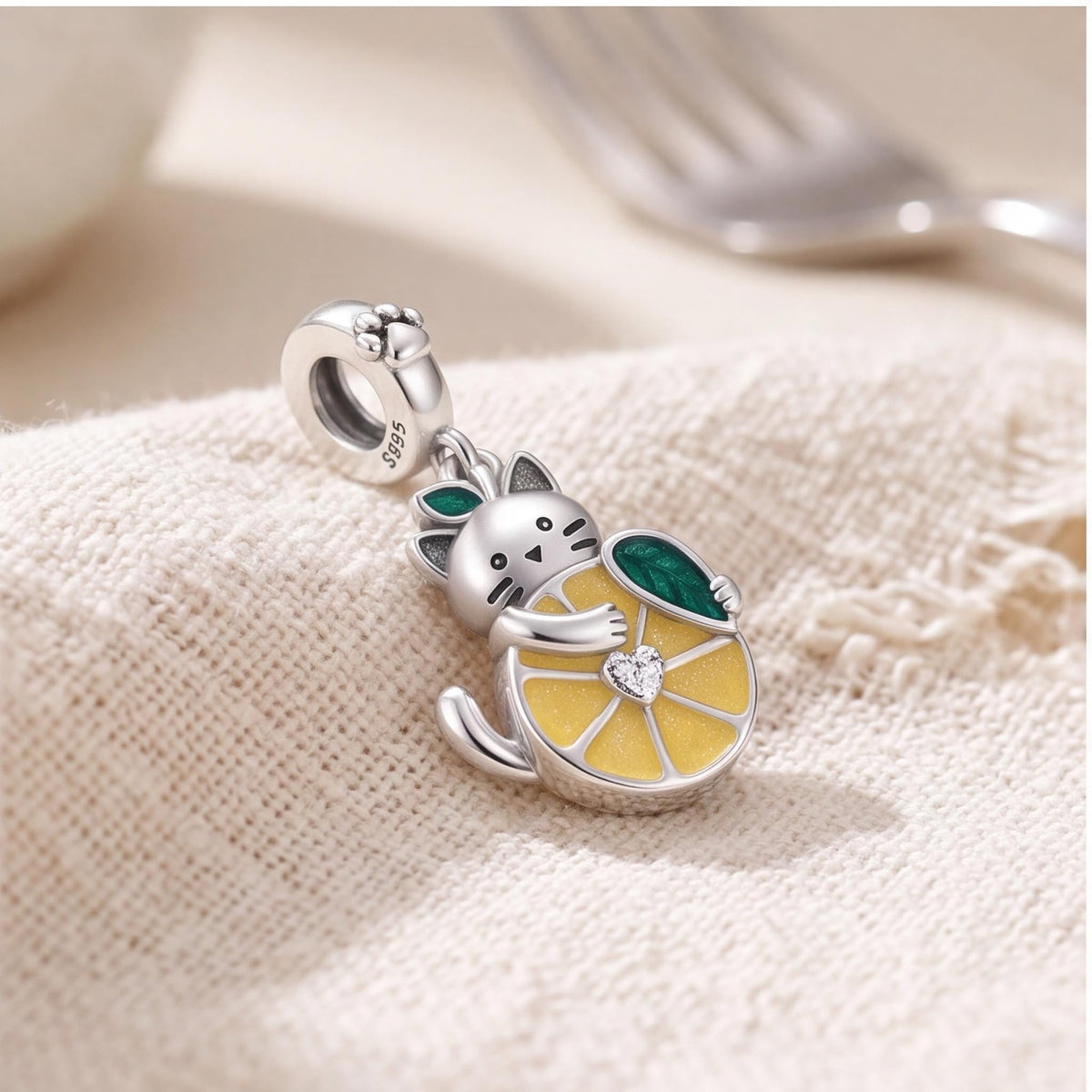 Cat Lemon Dangle Charm on a silver charm bracelet