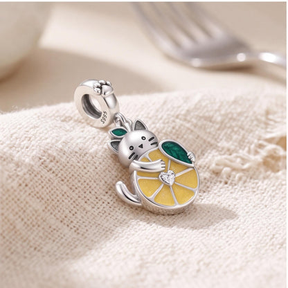 Cat Lemon Dangle Charm on a silver charm bracelet