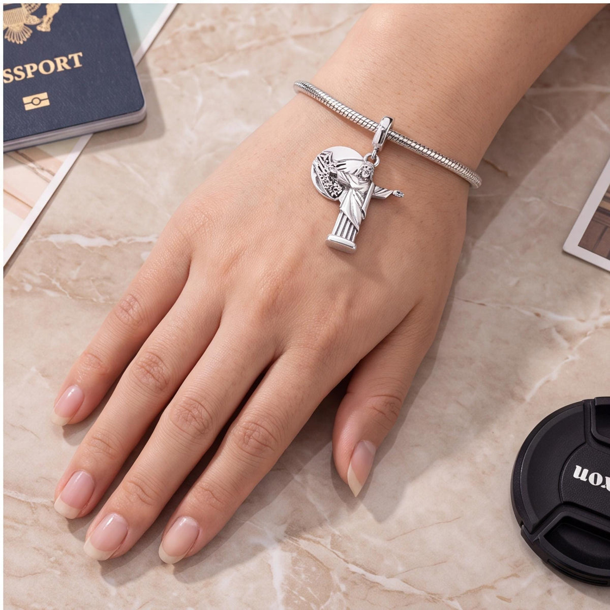 Christ Redeemer Dangle worn on a charm bracelet
