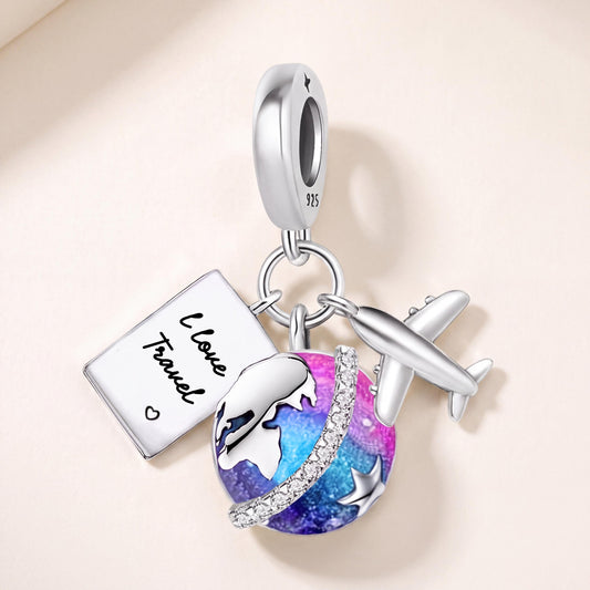 Travel Globe Charm in 925 sterling silver with blue and purple enamel and sparkling stones