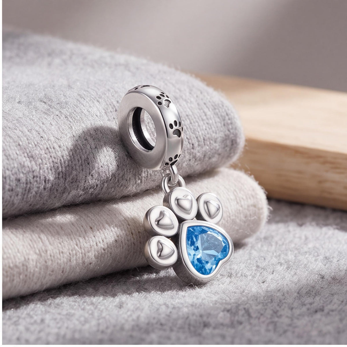 Paw Print Dangle Charm on a silver charm bracelet