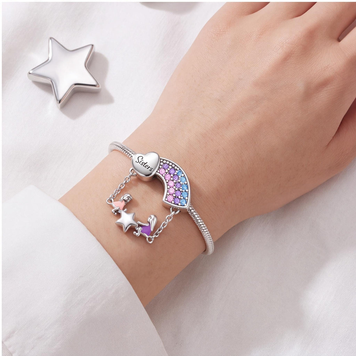 Sisters Rainbow Charm worn on a charm bracelet