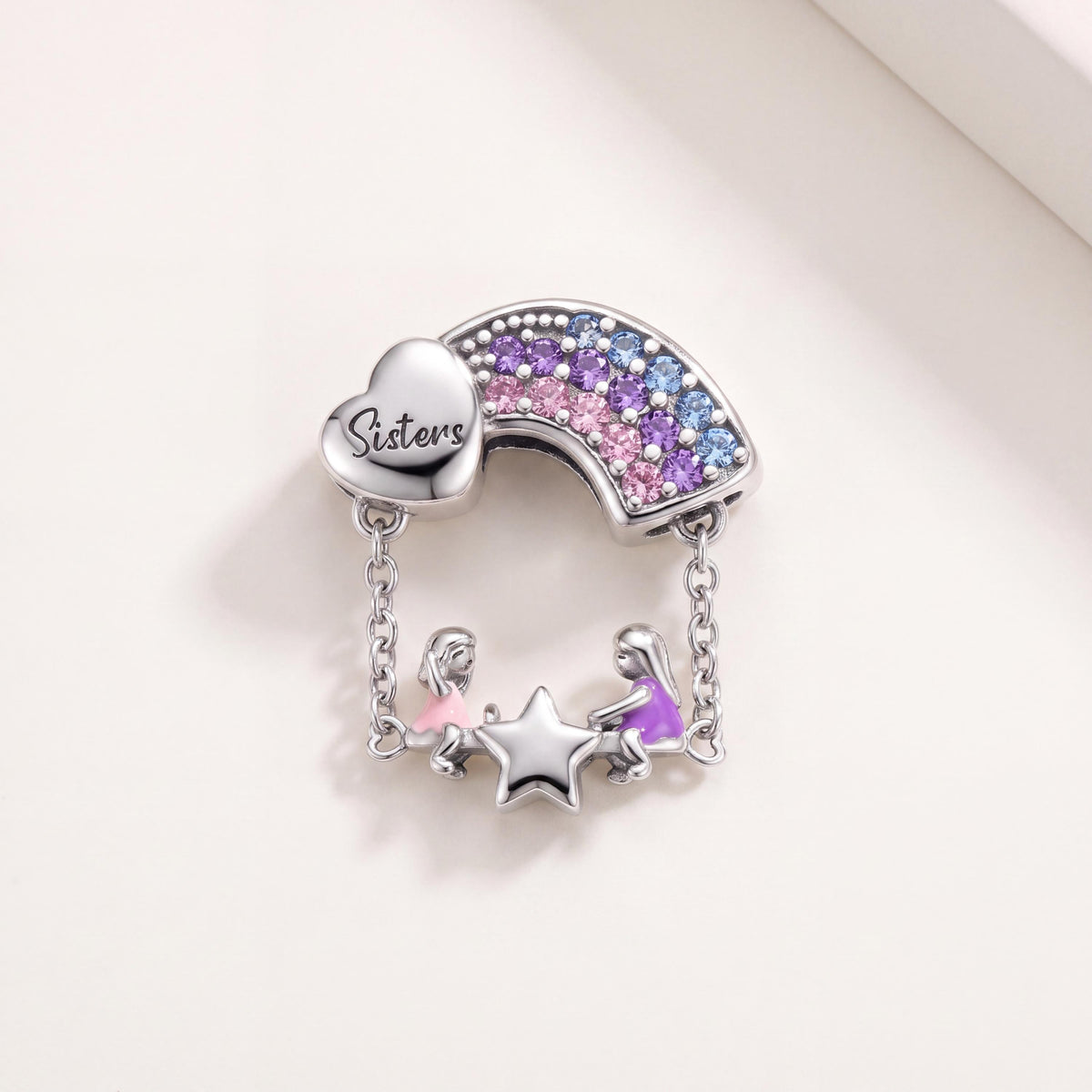 Sisters Rainbow Charm in 925 sterling silver with pink and purple enamel and sparkling stones