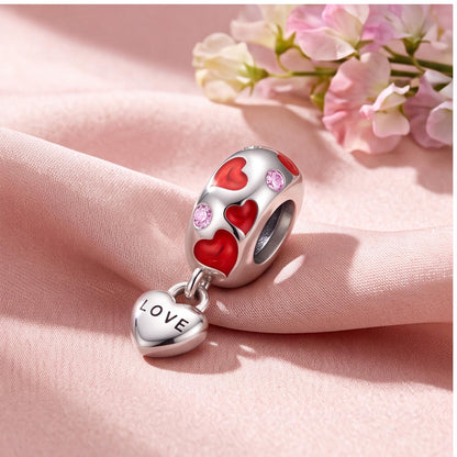 Red Enamel Love Heart Charm on a silver charm bracelet