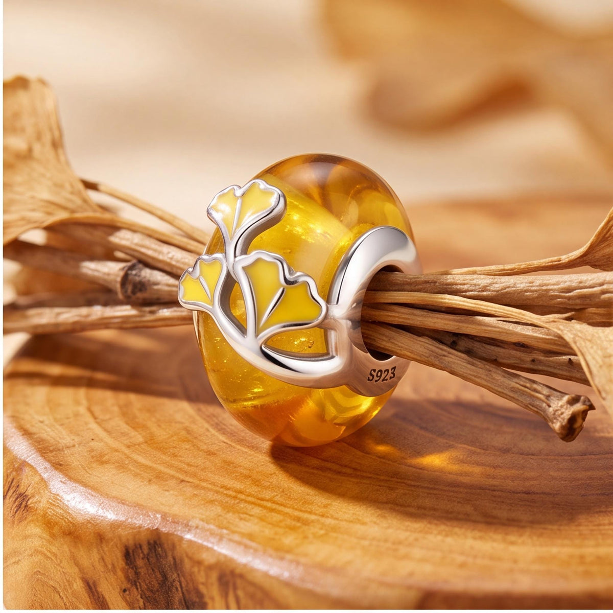 Ginkgo Leaf Bead on a silver charm bracelet