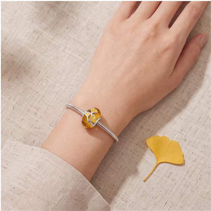 Ginkgo Leaf Bead close-up on a bracelet