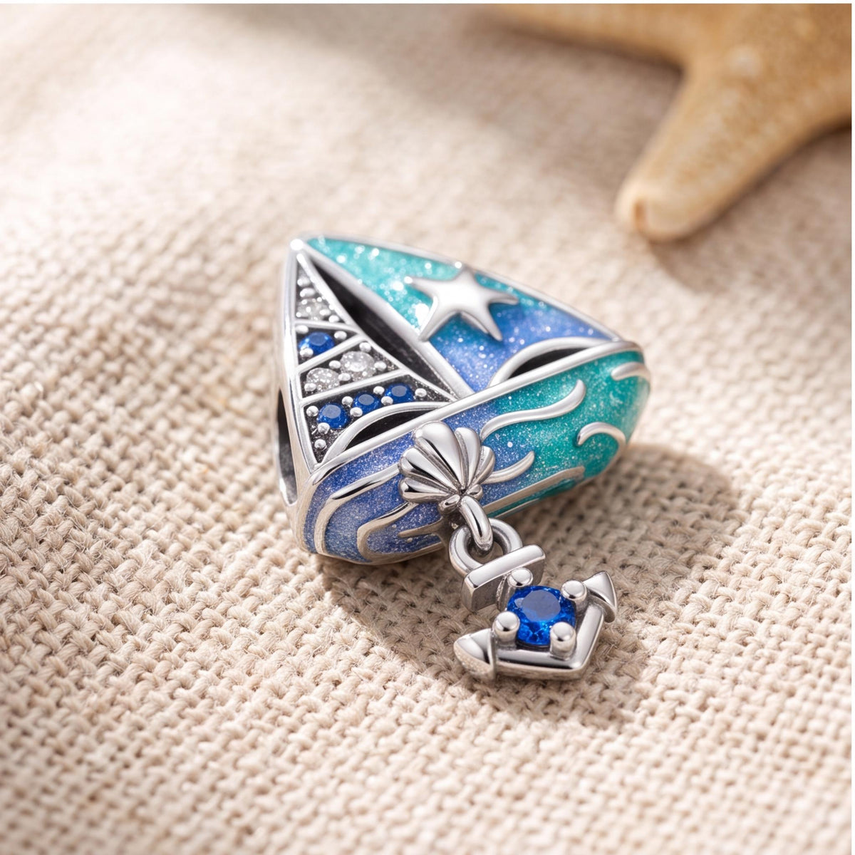 Blue Sailboat Charm on a silver charm bracelet