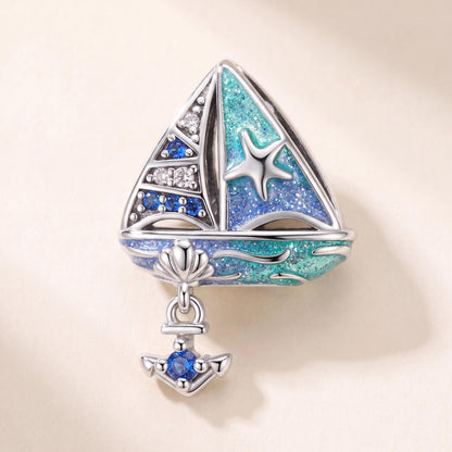 Blue Sailboat Charm in 925 sterling silver with blue enamel and sparkling stones, fits European-style charm bracelets