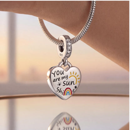 Sunshine Heart Dangle close-up on a bracelet