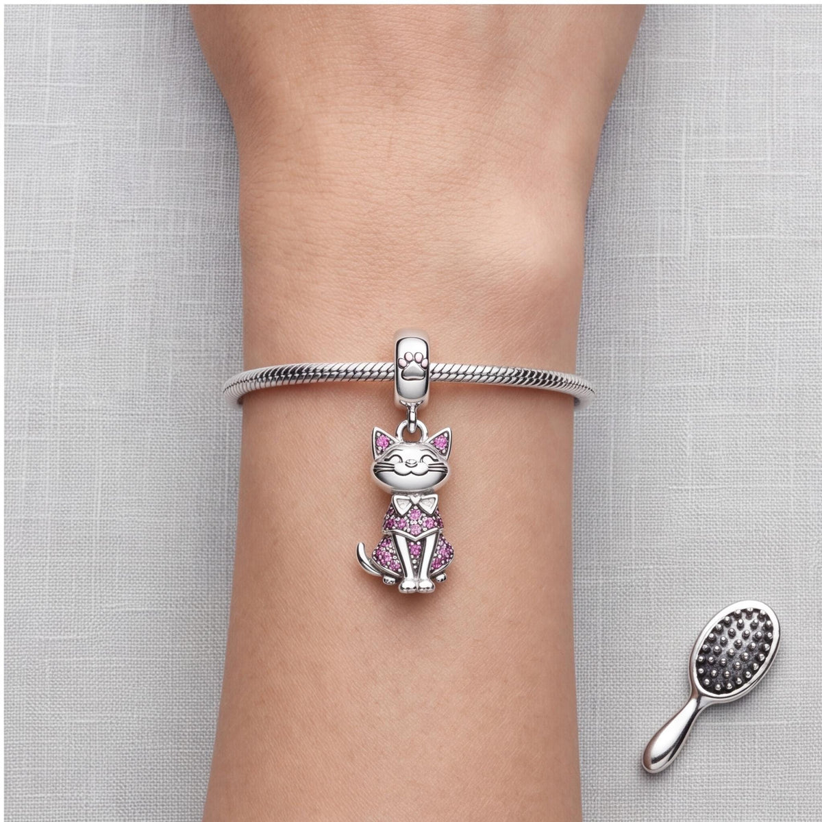 Pink Cat Dangle Charm worn on a charm bracelet