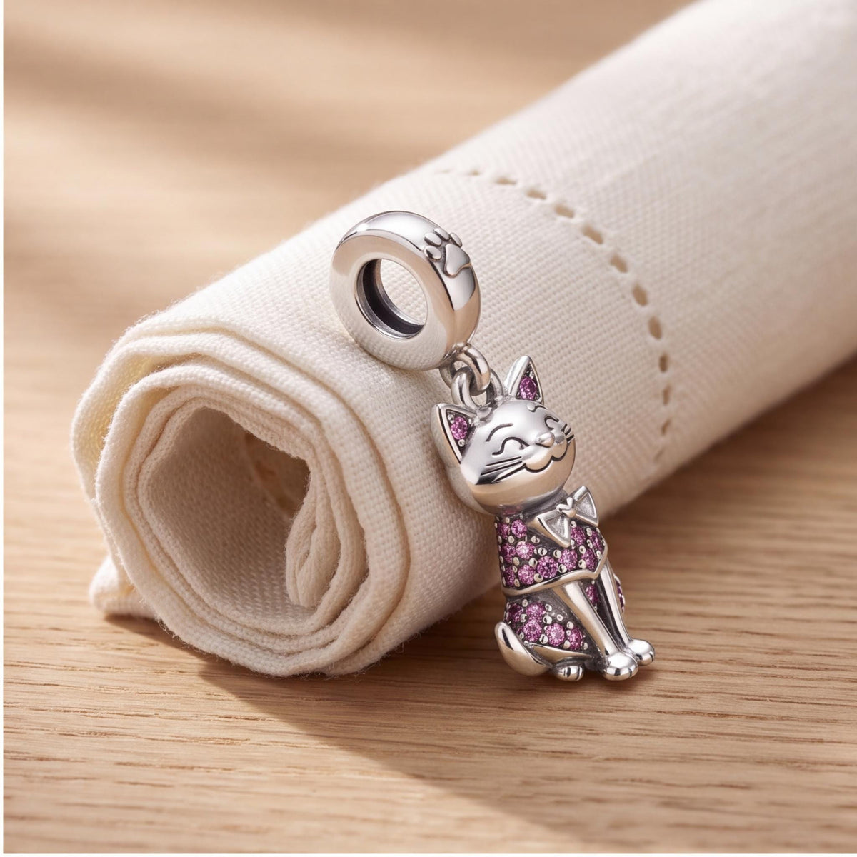 Pink Cat Dangle Charm on a silver charm bracelet