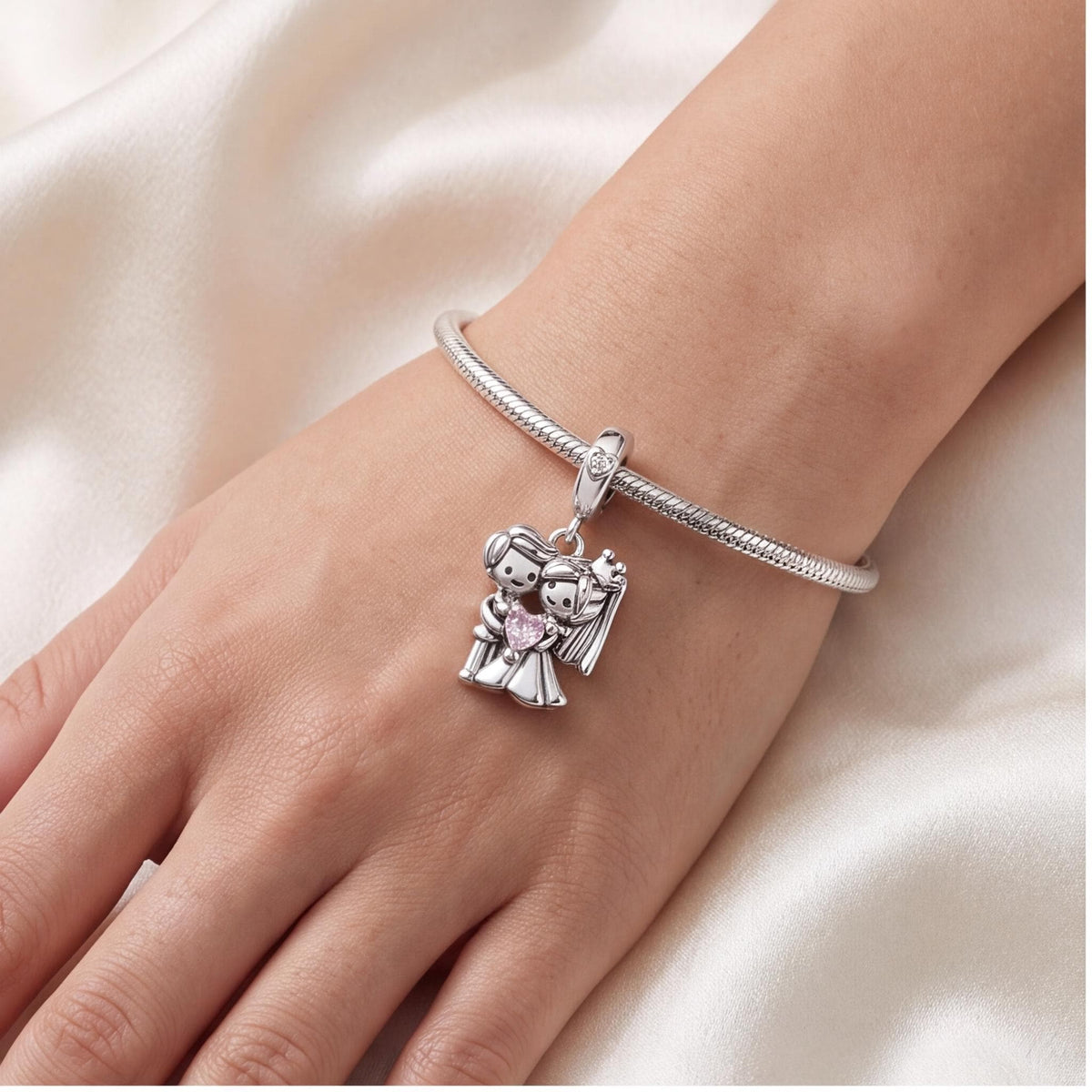 Bride and Groom Charm close-up on a bracelet