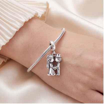 Kissing Bride and Groom Dangle close-up on a bracelet
