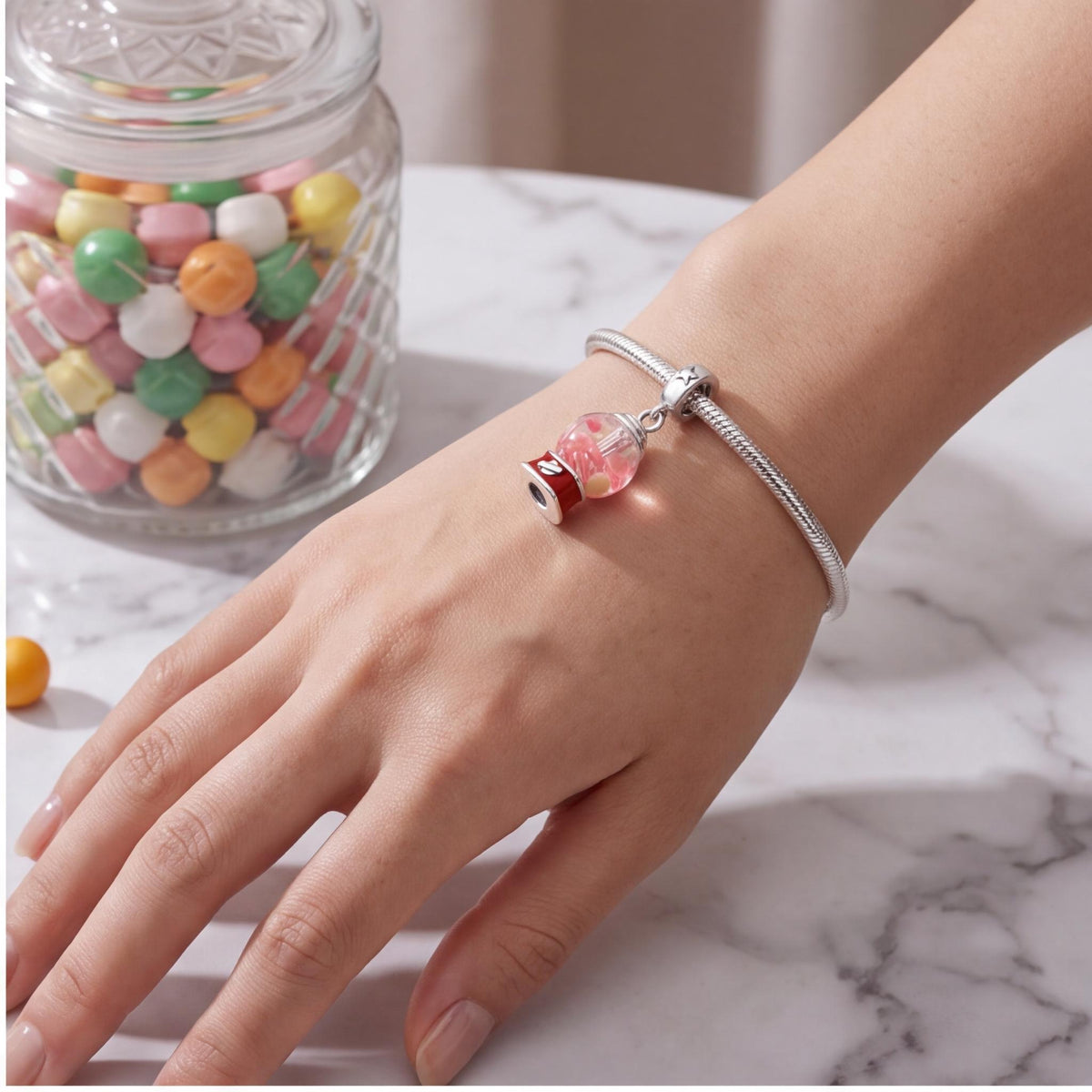 Gumball Machine Charm close-up on a bracelet