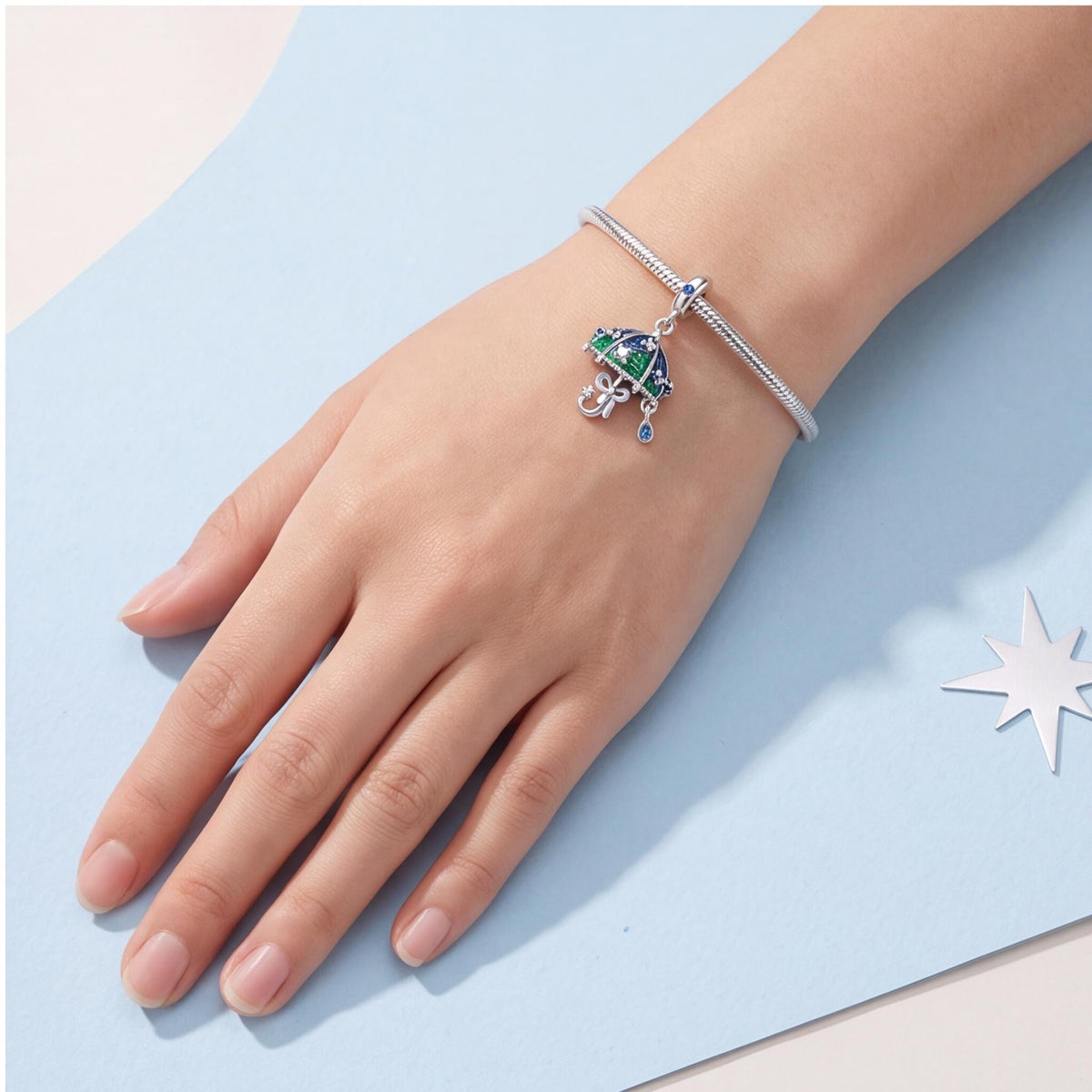 Raindrop Umbrella Charm worn on a charm bracelet