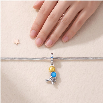 Astronaut Dangle Charm close-up on a bracelet