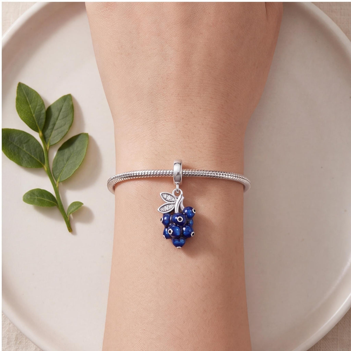 Blueberry Dangle Charm worn on a charm bracelet