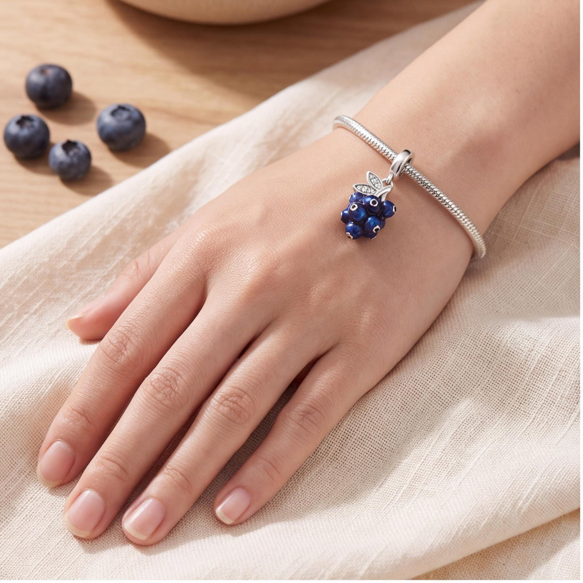 Blueberry Dangle Charm close-up on a bracelet