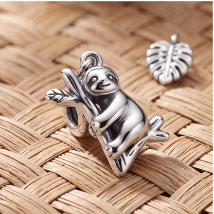 Climbing Sloth Dangle Charm styled as a gift