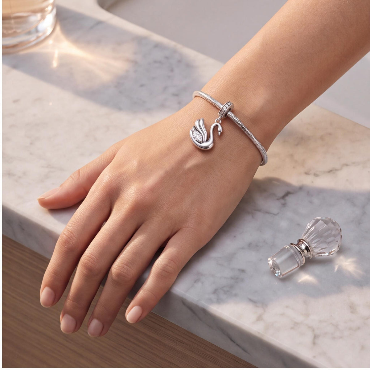 Swan Dangle Charm worn on a charm bracelet