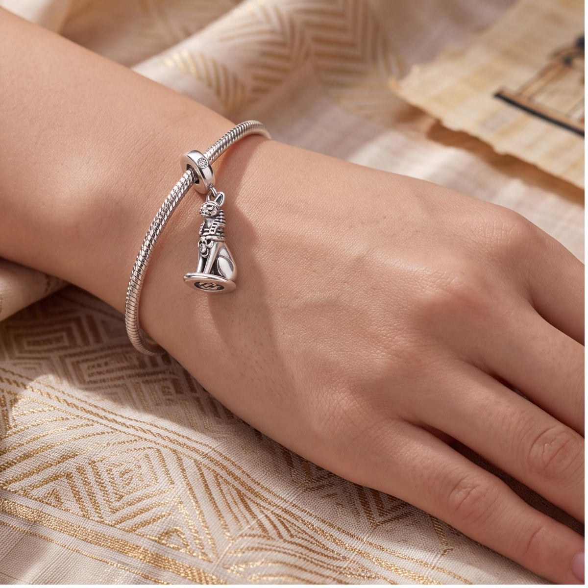 Egyptian Cat Charm close-up on a bracelet