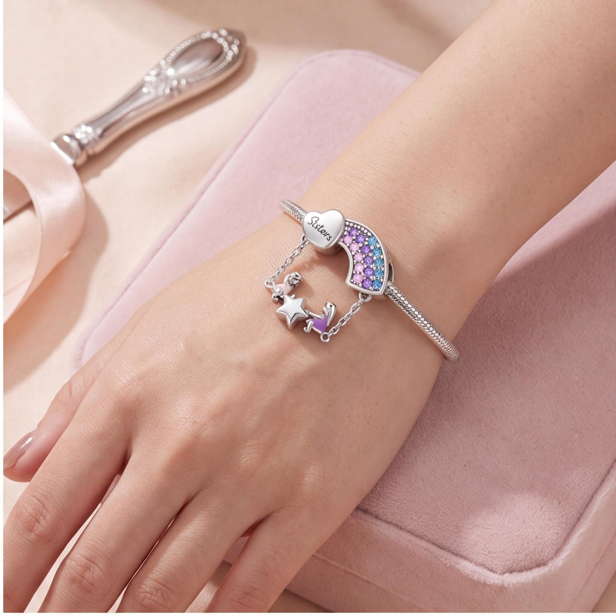 Sisters Rainbow Charm close-up on a bracelet