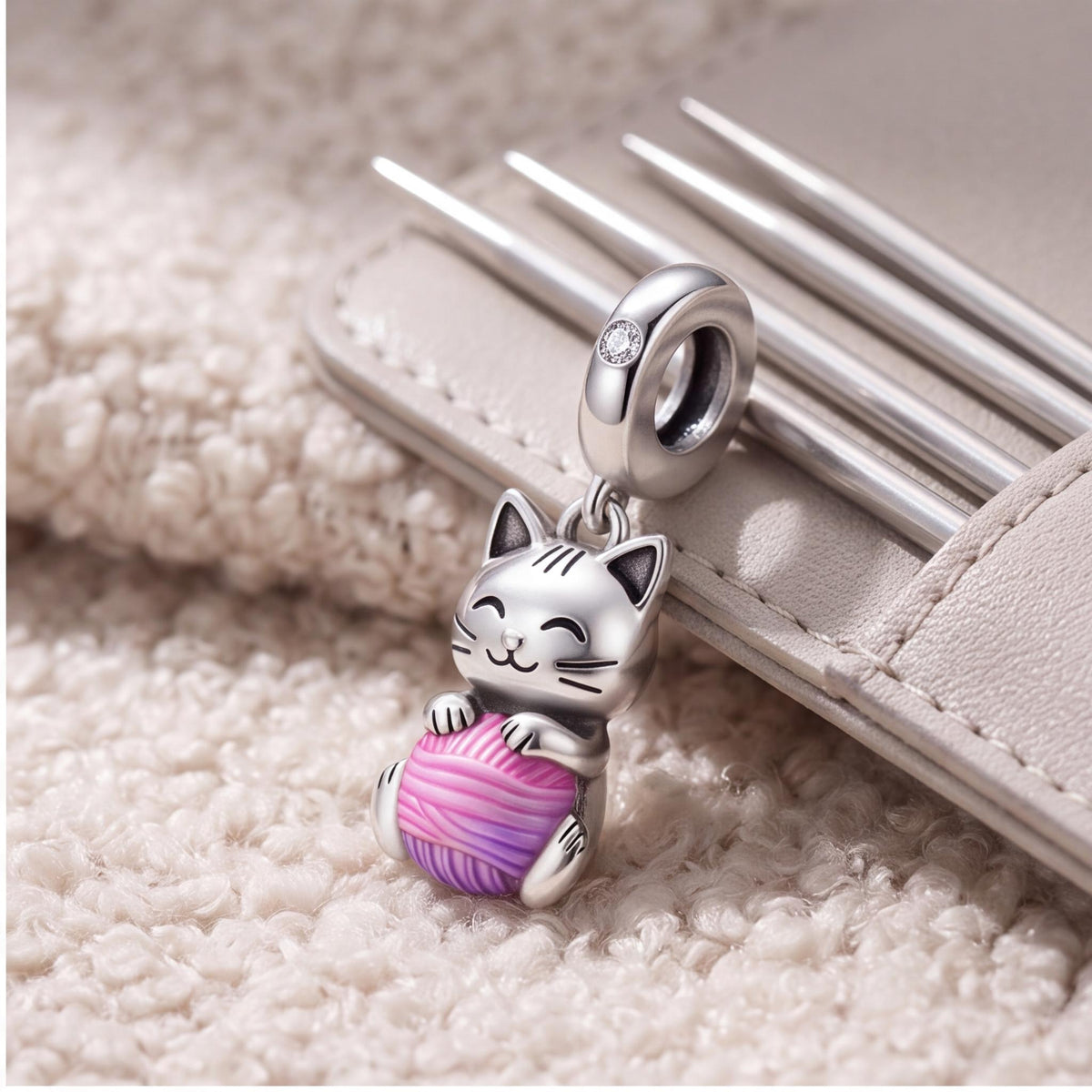 Cat Yarn Ball Charm on a silver charm bracelet