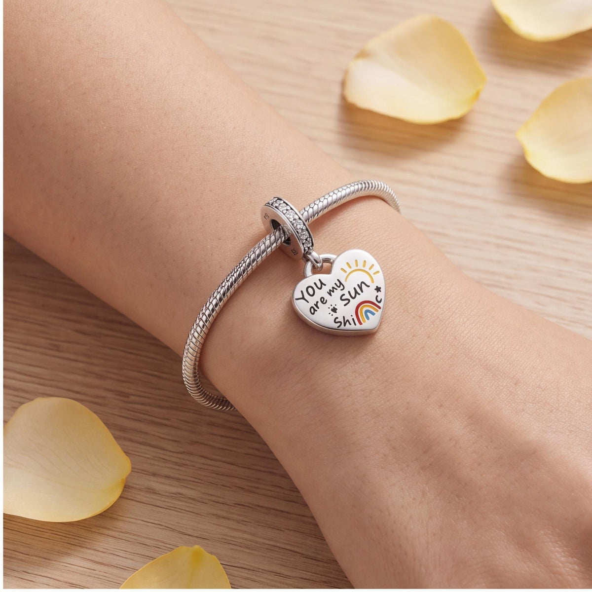 Sunshine Heart Dangle worn on a charm bracelet
