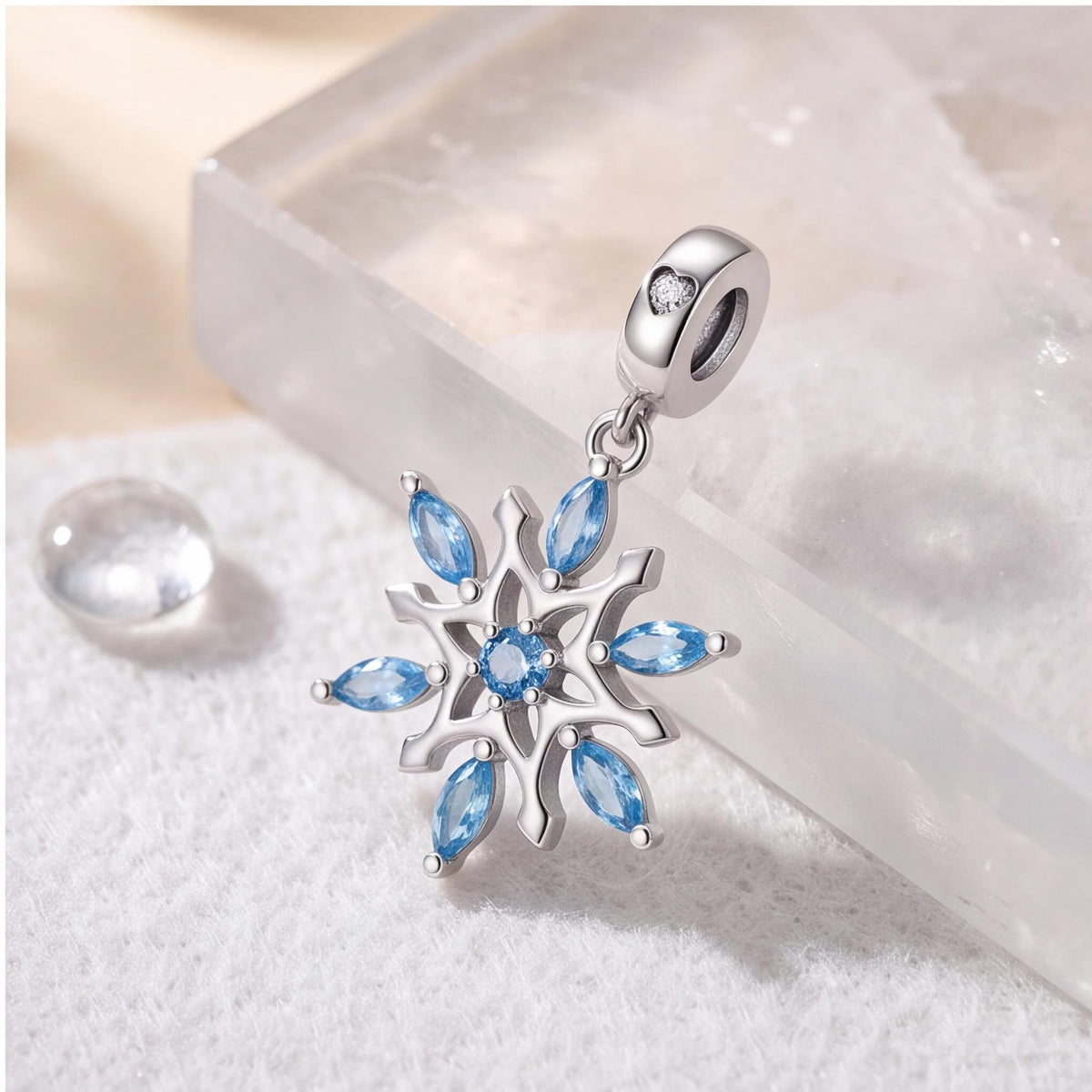Blue Snowflake Charm on a silver charm bracelet