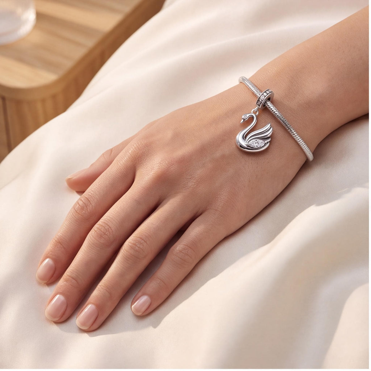 Swan Dangle Charm close-up on a bracelet
