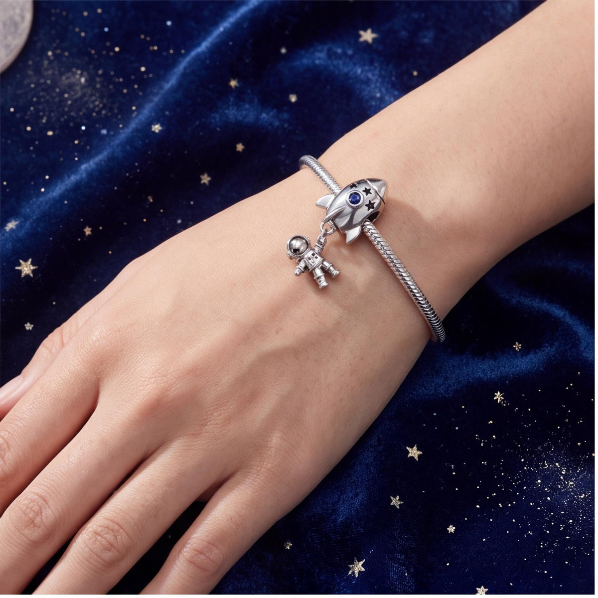 Rocket Astronaut Charm close-up on a bracelet