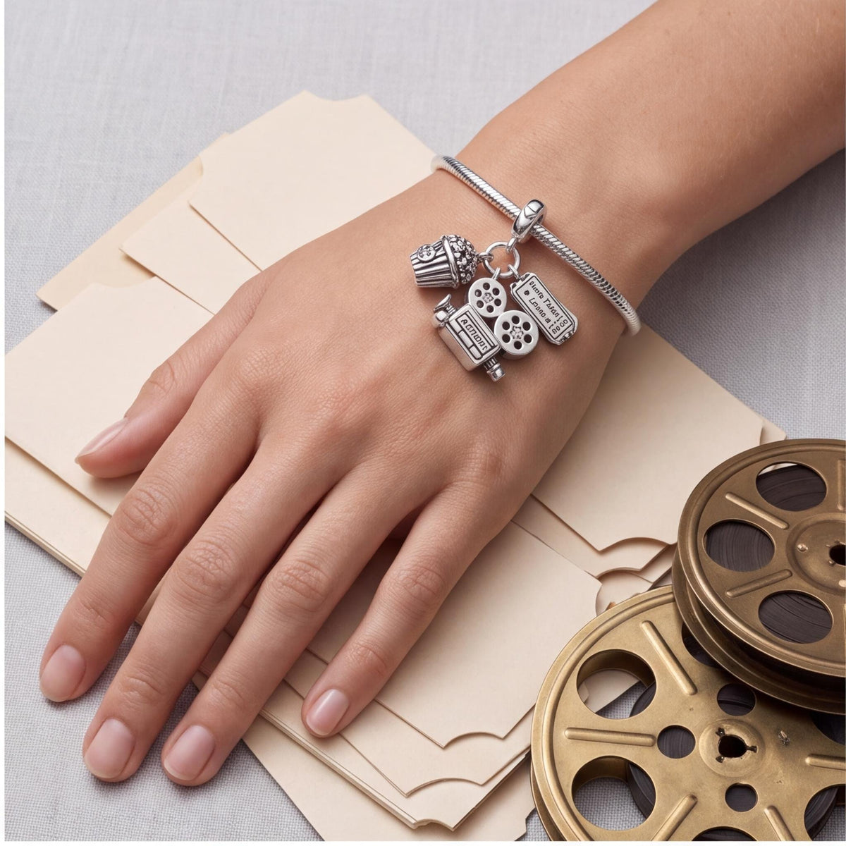 Cinema Dangle Charm worn on a charm bracelet