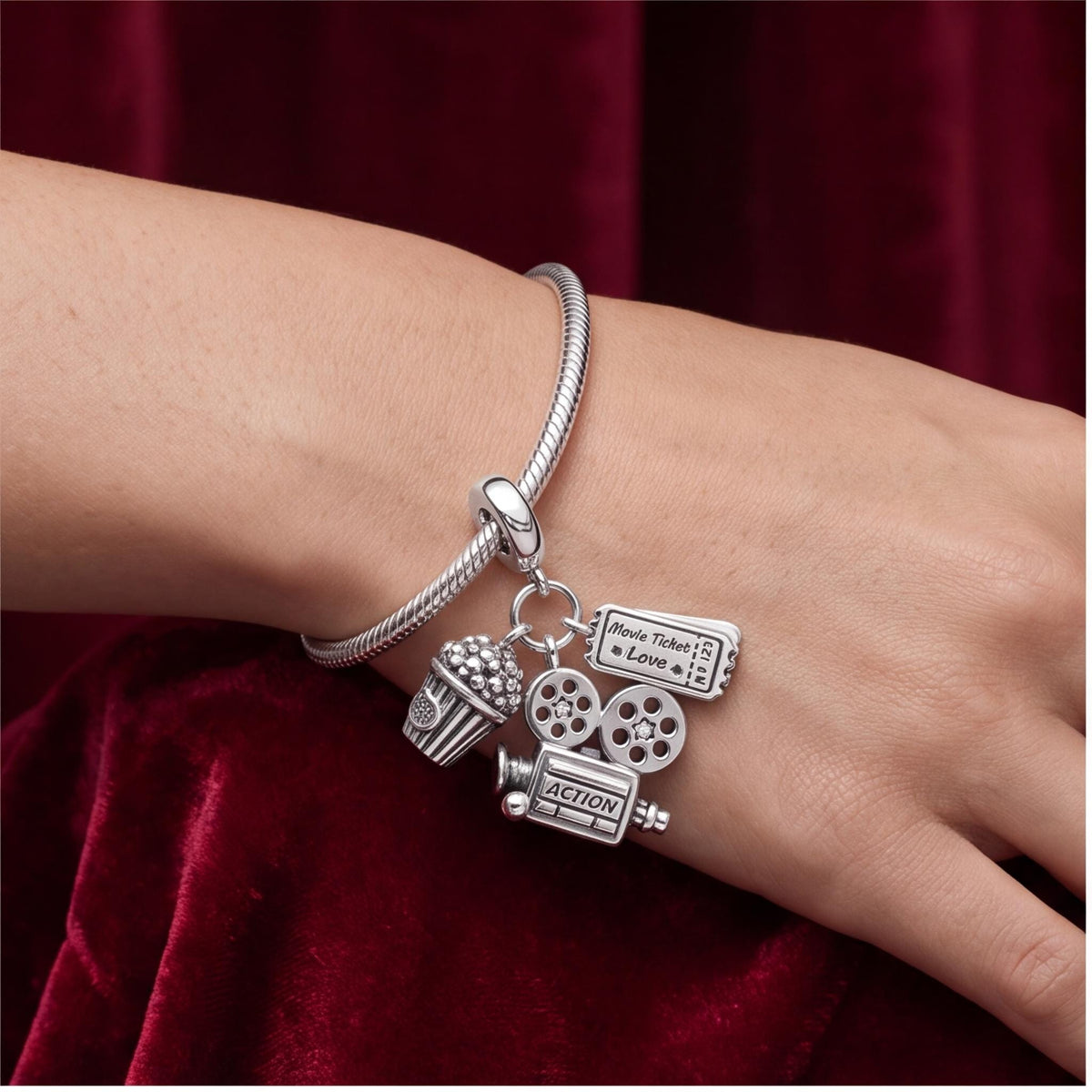 Cinema Dangle Charm close-up on a bracelet