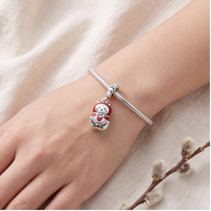 Cat Nesting Doll Charm worn on a charm bracelet