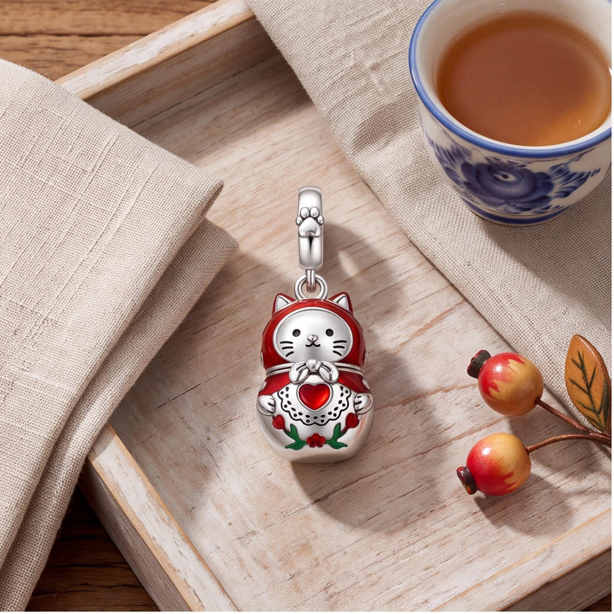Cat Nesting Doll Charm styled as a gift