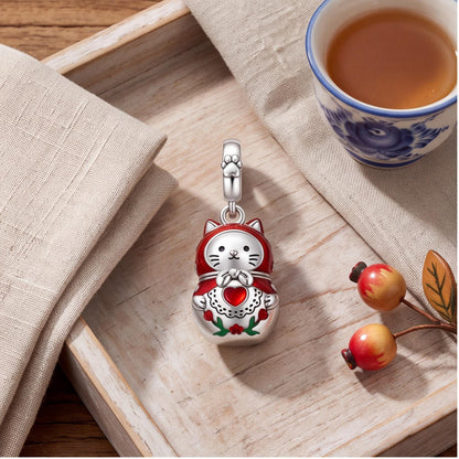 Cat Nesting Doll Charm styled as a gift