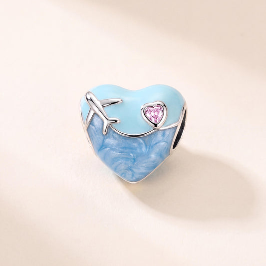 Travel Heart Charm in 925 sterling silver with blue and pink enamel and sparkling stones, fits European-style charm bracelets