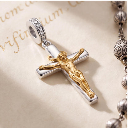 Crucifix Dangle Charm on a silver charm bracelet